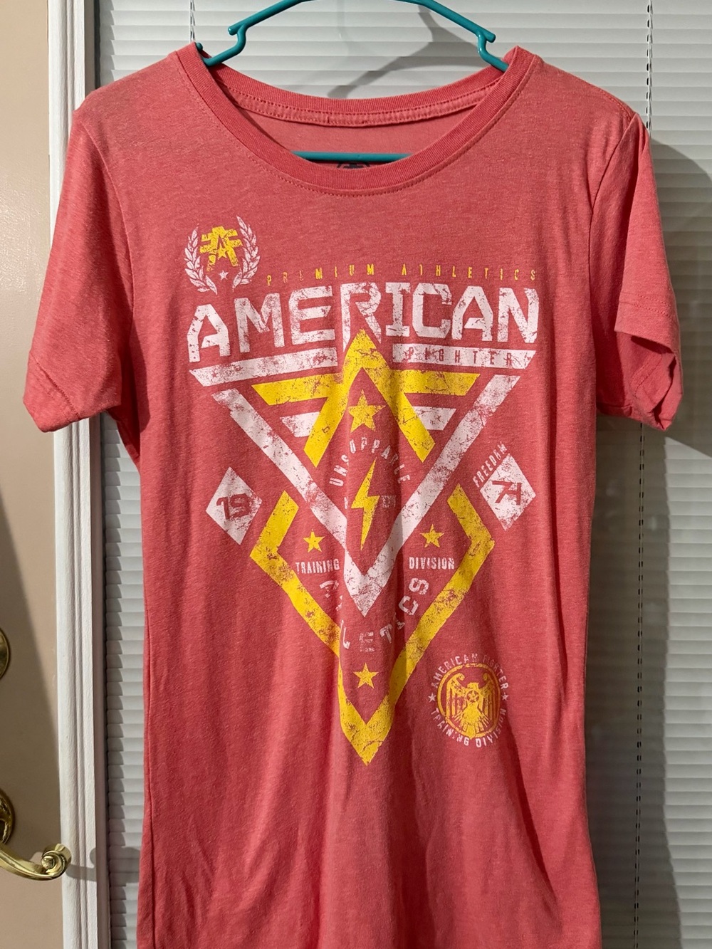 American Fighter Coral Tee with Yellow & White Graphic